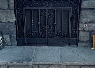 fireplace screen on stone hearth